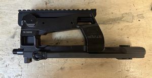 Gunsmith performing barrel threading and pin and weld work on a rifle