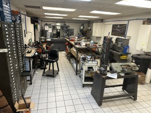 Professional gunsmith performing firearm repair and maintenance services
